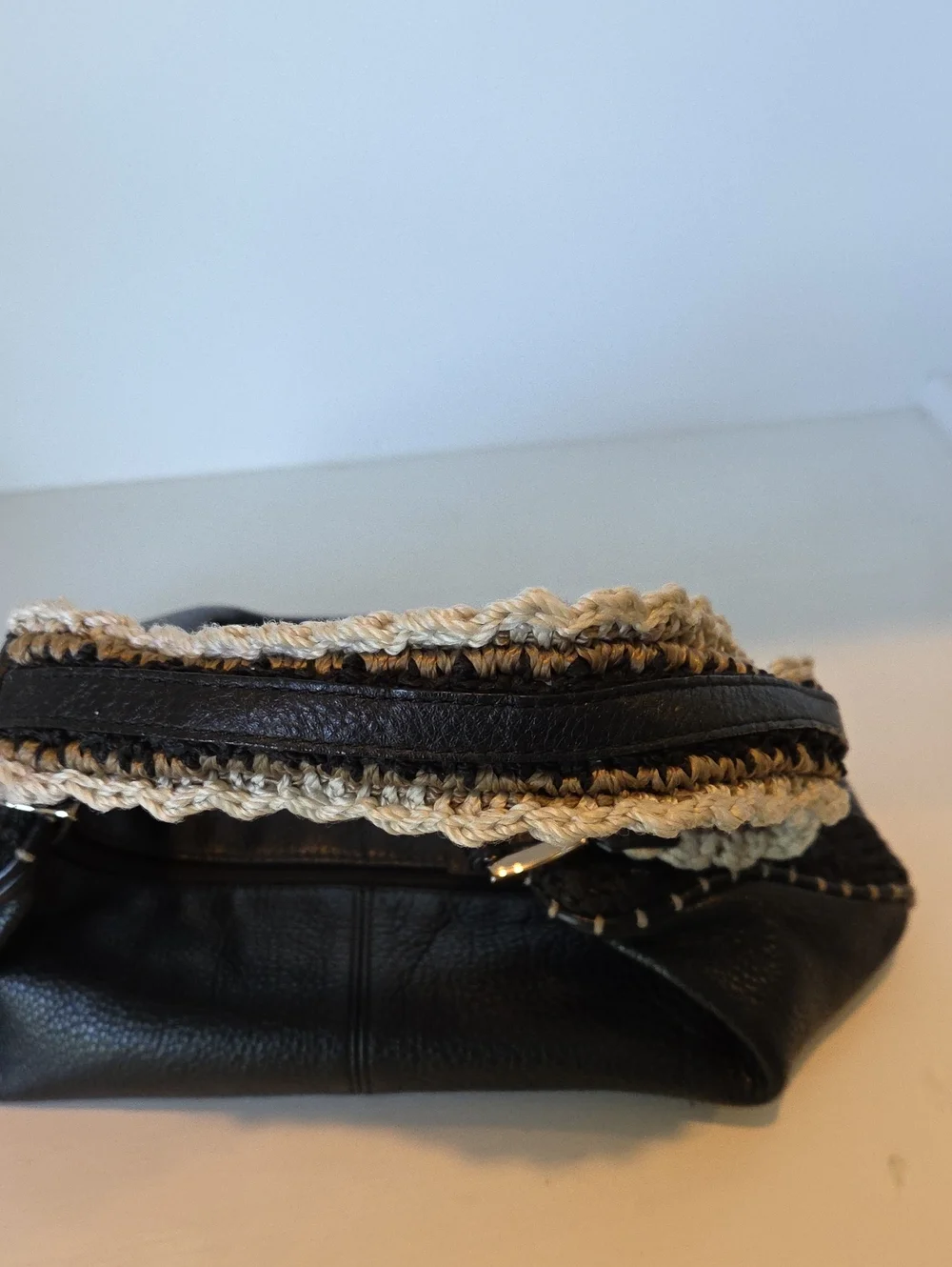 The Sak Pink Label knitted handle black leather handbag.